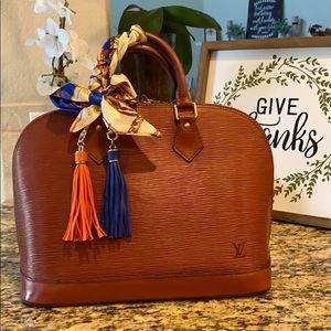 Louis Vuitton Brown (orangy-brown) Alma PM.